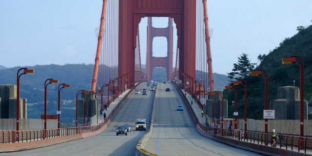 Light traffic is seen on the evening commute over the Golden Gate Bridge on Friday, March 27, 2020, in Sausalito, Calif.