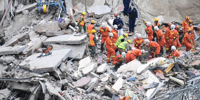 The death toll increased to 20 on Tuesday, with 10 still missing, as rescuers continue searching the rubble. (Lin Shanchuan/Xinhua via AP)