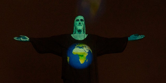 Christ the Redeemer lit up with every country affected by coronavirus: 'Pray together' 2 Rio's Christ the Redeemer statue is lit up with an image of the earth, as a way to show support for those afflicted by the new coronavirus, in Rio de Janeiro, Brazil, Wednesday, March 18, 2020.