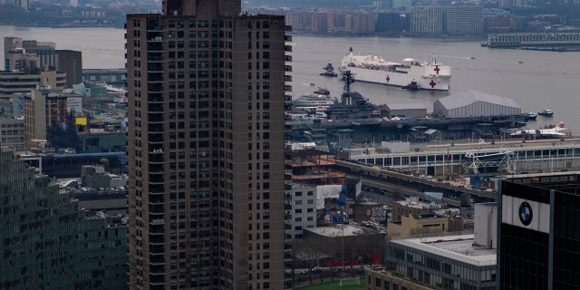 The Navy hospital ship USNS Comfort moves along the Hudson River before docking in New York, Monday, March 30, 2020.