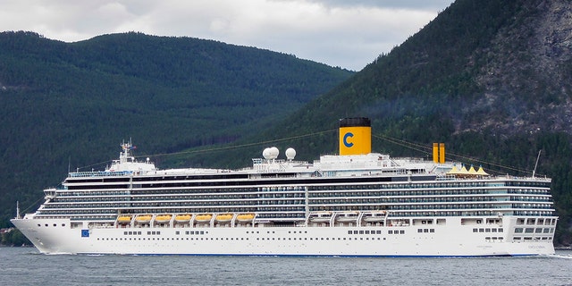 Leikanger, Norway - August 8, 2012: Costa Luminosa cruise ship sailing through the Sognefjord near the town of Leikanger in Norway. 