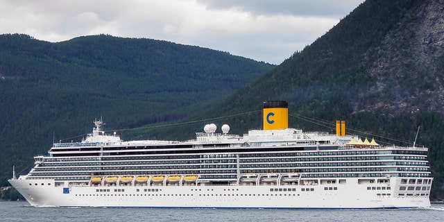 Leikanger, Norway - August 8, 2012: Costa Luminosa cruise ship sailing through the Sognefjord near the town of Leikanger in Norway.