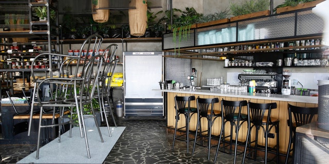 A closed restaurant is seen at a shopping center in Hadera, Israel, Sunday, March 15, 2020. Israel has imposed a number of tough restrictions to slow the spread of coronavirus.