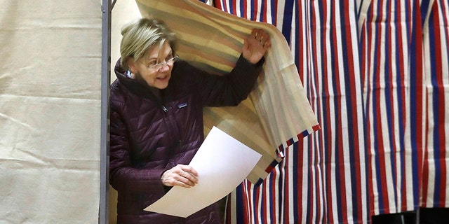 Democratic presidential candidate Sen. Elizabeth Warren, D-Mass., emerges from the booth with her ballot as she votes on Tuesday, March 3, 2020, in Cambridge, Mass. (AP Photo/Steven Senne)