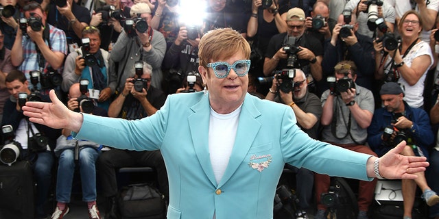 Singer Elton John poses for photographers at the photo call for the film 'Rocketman' at the 72nd international film festival, Cannes