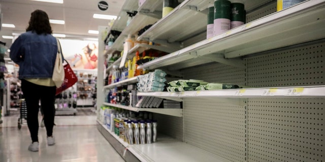 Empty shelves for disinfectant wipes wait for restocking, as concerns grow around COVID-19, Tuesday March 3, 2020, in New York. 