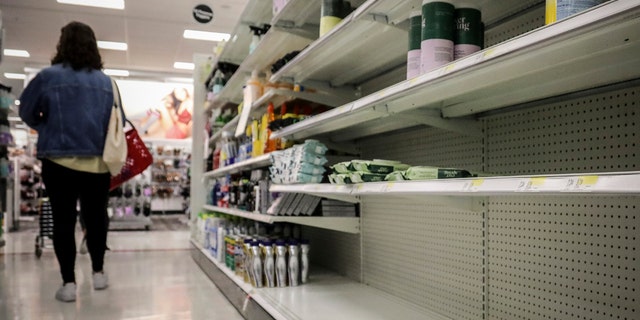 Empty shelves for disinfectant wipes wait for restocking, as concerns grow around COVID-19, Tuesday March 3, 2020, in New York.