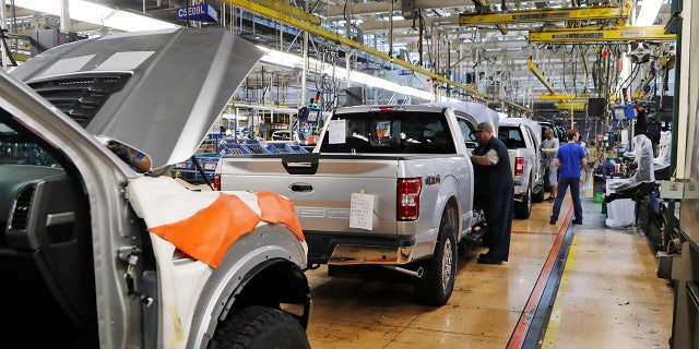 United Auto Workers assembly workers assemble 2018 Ford F-150 trucks at the Ford Rouge assembly plant in Dearborn, Mich., Sept. 27, 2018. (Associated Press)