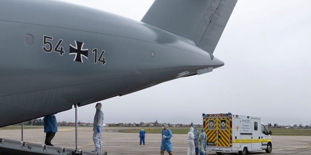 A German Luftwaffe Airbus A400M sits on the tarmac on the Strasbourg airport to evacuate French patients affected with the Covid-19 disease. (Tanhao Stadel/Dicod via AP)