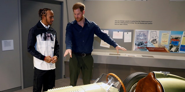 Prince Harry, Duke of Sussex speaks with Formula One World Champion Lewis Hamilton as he officially opens The Silverstone Experience at Silverstone on March 6.