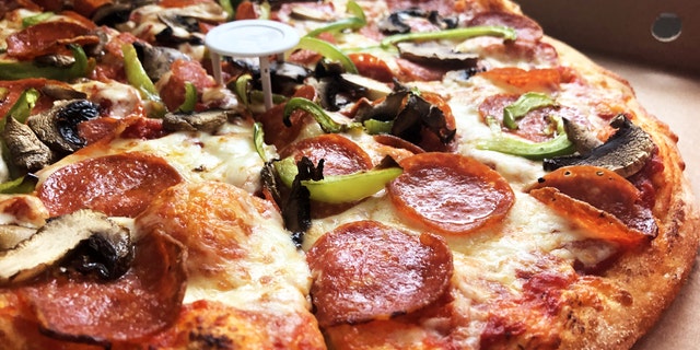 The design is modeled after the plastic table in pizza boxes to keep pizzas from getting crushed.