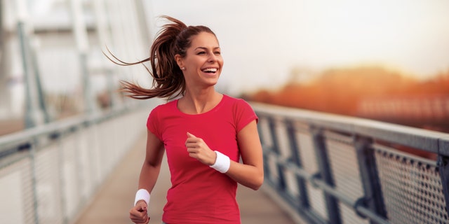 Young fitness woman jogging