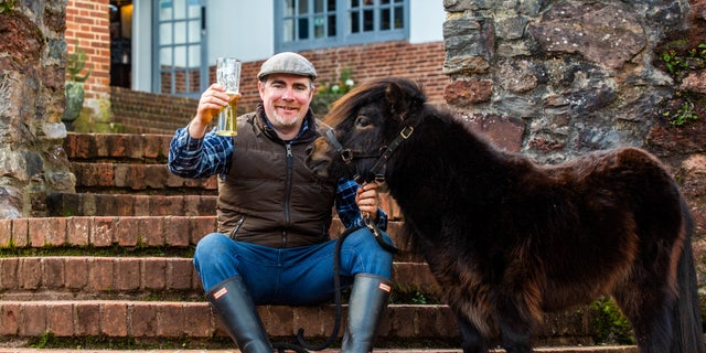 Around 100 people were scheduled to attend a village pub to mark the second birthday of the stout-loving Shetland named Patrick, pictured, on St Patrick's Day.