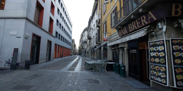 A deserted street at the Brera artistic district in Milan, Italy, Wednesday, March 11, 2020. Italy is mulling even tighter restrictions on daily life and has announced billions in financial relief to cushion economic shocks from the coronavirus. For most people, the new coronavirus causes only mild or moderate symptoms, such as fever and cough. For some, especially older adults and people with existing health problems, it can cause more severe illness, including pneumonia.