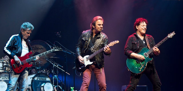 Bassist Ross Valory, keyboardist Jonathan Cain, and founder and guitarist Neal Schon of the band Journey are seen at Prudential Center on June 15, 2018 in Newark, New Jersey. 