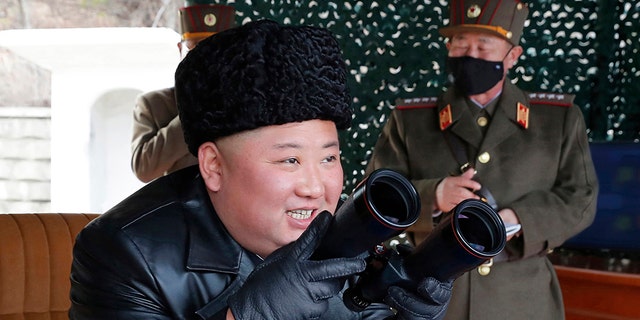In this photo provided by the North Korean government, North Korean leader Kim Jong Un inspects a military drill at undisclosed location in North Korea on Monday, March 2, 2020. (Korean Central News Agency/Korea News Service via AP)