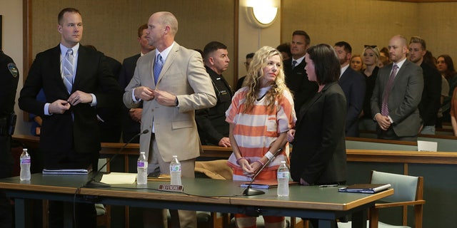 Lori Vallow Daybell, front, second right, and her defense team wait to leave the courtroom during her hearing on Friday, March 6, 2020, in Rexburg, Idaho. Daybell who is charged with felony child abandonment after her two children went missing nearly six months ago had her bond reduced to $1 million by an Idaho judge on Friday. (John Roark/The Idaho Post-Register via AP, Pool)