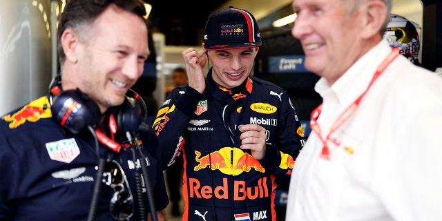 Red Bull F1 advisor Helmut Marko (R) is seen here with Team Principal Christian Horner (L) and driver Max Verstappen (C).