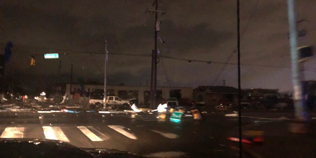 Debris scattered across an intersection Tuesday, March 3, 2020, in downtown Nashville, Tenn.