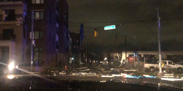 Debris scattered across an intersection Tuesday, March 3, 2020, in downtown Nashville, Tenn. The National Weather Service in Nashville confirmed a tornado touched down in the area.