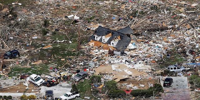 The remains of homes shattered by storms are scattered near Cookeville, Tenn., Tuesday, March 3, 2020.
