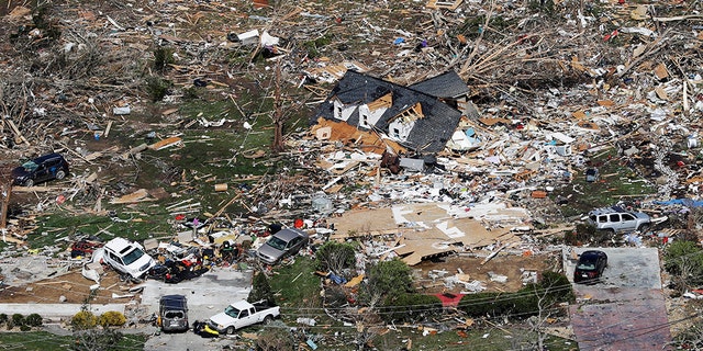 The remains of homes shattered by storms are scattered near Cookeville, Tenn., Tuesday, March 3.