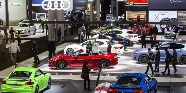 Attendees walk through the exhibition floor of the 2019 New York International Auto Show (NYIAS) in New York, U.S., on Thursday, April 18, 2019. The NYIAS, North America's first and largest-attended auto show dating back to 1900, showcases an incredible collection of cutting-edge design and extraordinary innovation. (Natan Dvir/Bloomberg via Getty Images)