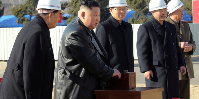In this March 17, photo provided by the North Korean government, North Korean leader Kim Jong Un, center, attends the ground-breaking ceremony of a general hospital in Pyongyang in North Korea.