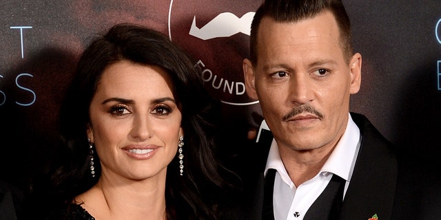 Penelope Cruz and Johnny Depp at the "Murder On The Orient Express" premiere in 2017. (Photo by Dave J Hogan/Dave J Hogan/Getty Images)