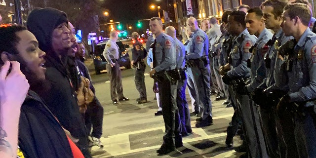 Demonstrators come face to face with police in Raleigh, N.C., March 11, 2020. (Associated Press)