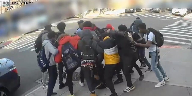 Video captured a group of teenage boys kicking a 15-year-old girl and stealing her Air Jordan sneakers during a mugging in Brooklyn Thursday afternoon.