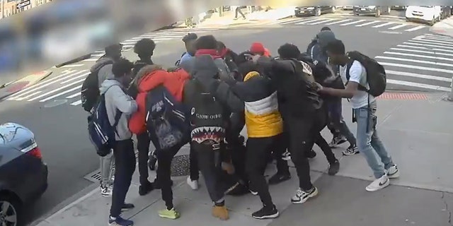 Video captured a group of teenage boys kicking a 15-year-old girl and stealing her Air Jordan sneakers during a mugging in Brooklyn Thursday afternoon.