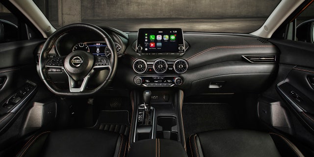 The Sentra has a tablet-style infotainment system screen.