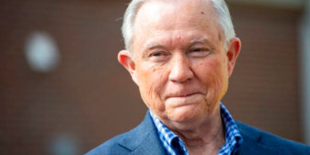 Jeff Sessions talks with the media after voting in Alabama's primary election, Tuesday, March 3, 2020, in Mobile, Ala. The former Attorney General is part of a seven person field in the state's Republican Senate primary, along with former Auburn University football coach Tommy Tuberville, U.S. Rep. Bradley Byrne and former Alabama Chief Justice Roy Moore, jockeying for the GOP nomination and the right to challenge Democratic Sen. Doug Jones in November. (AP Photo/Vasha Hunt)