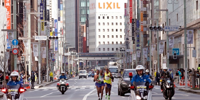 Top contenders race the Tokyo Marathon in Tokyo, Sunday, March 1, 2020. Organizers of the Tokyo Marathon reduced the number of participants out of fear of the spread of the coronavirus.