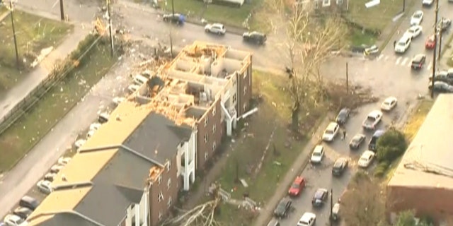 Damaged homes can be seen in one Nashville neighborhood on Tuesday.