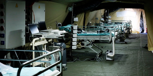 Beds line up at the military field hospital in eastern border city of Mulhouse on Tuesday. The Grand Est region is the epicenter of the outbreak in France. (Mathieu Cugnot, Pool via AP)