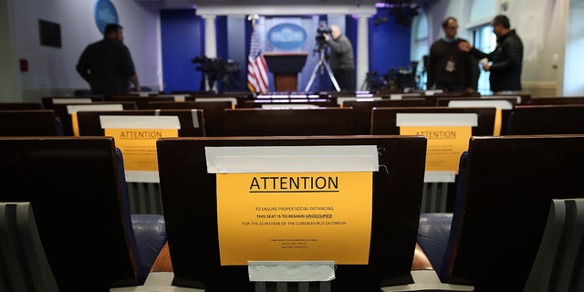 WASHINGTON, DC - MARCH 16: Seats in the White House press briefing room are marked with warnings to maintain social distancing March 16, 2020 in Washington, DC. (Photo by Win McNamee/Getty Images)