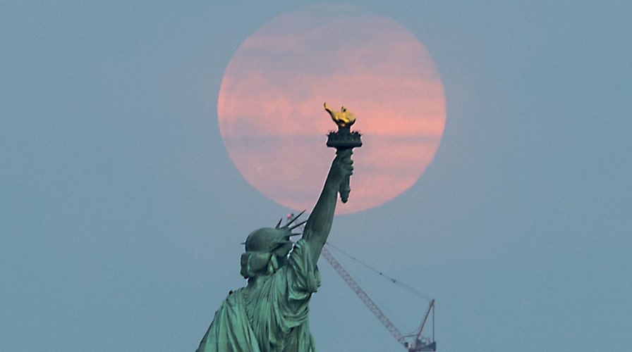 'Full worm supermoon' lights up the sky in stunning pictures