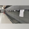 A view of empty shelves at a supermarket after customers rush to stock up on toilet paper and hand sanitizer in Brisbane, Australia, Mar. 8, 2020.