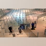 A TSA agent speaks to travelers passing through an empty security queue at Love Field airport?amid concerns of the coronavirus pandemic?in Dallas, Mar. 12, 2020.