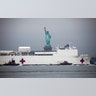 The U.S. Navy hospital ship?"Comfort" passes in front of the Statue of Liberty as it arrives in New York City, March 30, 2020.?