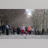 People walk and jog along the Hudson River in Hoboken, N.J., March 17, 2020.