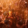 Indian revelers with their faces smeared with colored powder, dance during celebrations to mark Holi, the Hindu festival of colors in Prayagraj, India, March 11, 2020. 