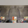 Empty bins that usually contain hand sanitizer products are seen in a store in New York City, Mar. 3, 2020.