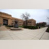 Sidewalks are empty around Strong Hall in the middle of the University of Kansas campus In Lawrence, Kan., Mar. 17, 2020.