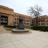 Sidewalks are empty around Strong Hall in the middle of the University of Kansas campus In Lawrence, Kan., Mar. 17, 2020.