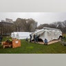 A Samaritan's Purse crew works on building an emergency field hospital equipped with a respiratory unit in Central Park across from the Mount Sinai Hospital, in New York City, March 29, 2020.