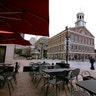 Tables are vacant in the nearly empty tourist area of Quincy Market in Boston, Mar. 11, 2020.