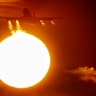 A Boeing 747 aircraft lifts off in front of the setting sun at the airport in Frankfurt, Germany, March 3, 2020. 